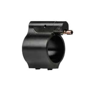 Black scope ring mount with a small brass tightening screw on the side, used to hold a rifle scope tube.