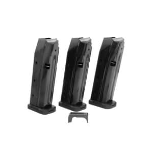 Three black handgun magazines standing upright on their bases, arranged in a row with a small metal clip in front of them