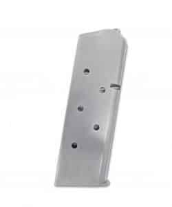 Metal firearm magazine viewed at an angle with round-count holes on the side, lying flat