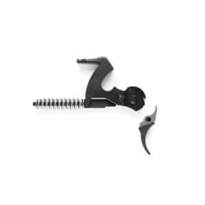Disassembled trigger mechanism with a metal coil spring and two dark grey parts.