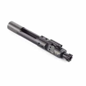 Black firearm bolt carrier group component with cylindrical body and mounted muzzle device, seen from side