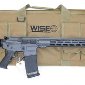 AR-15 style rifle with an extended handguard and 30‑round magazine resting on a tan carrying case labeled 'WISE ARMS LLC'