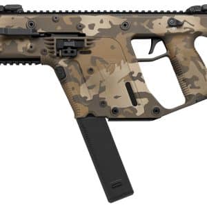 Side view of a tan camouflage assault rifle with a long magazine and tactical rail on top.