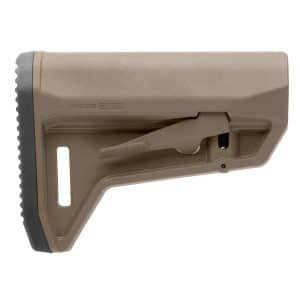 Partial view of a tan pistol, showing the slide with serrated edge and part of the grip.