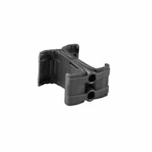 Close-up of a black plastic mounting bracket with circular holes, likely a rail mount for securing accessories to a firearm or device.