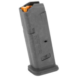 Close-up of a curved black pistol magazine with an orange follower visible at the top.