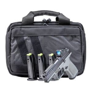 Black tactical bag with a handgun and multiple magazines arranged in front of it for scale and accessibility gear storage.