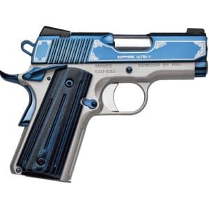 Close-up of a blue and silver semi-automatic pistol with ornate white scrollwork on the slide and grip area of the gun