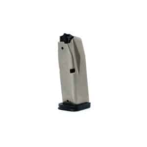Close-up of a gray metal staple gun/magazine with a black top, standing upright on a black base.