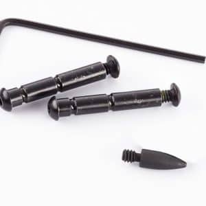 L-shaped hex wrench with two black pin-like fasteners and a separate rubber-tipped nozzle part of a small repair kit.