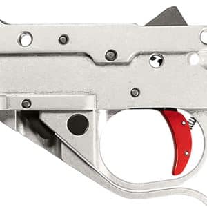 Close-up of a silver pistol trigger housing seen from the left, with a visible red trigger inside the trigger guard.
