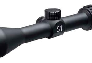 Riflescope with a green-tinted front lens, two adjustment turrets, and an 'S1' marking, used for precision aiming.