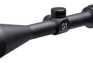 Black rifle scope with green-tinted objective lens and adjustment knobs for elevation and windage, viewed from the side.