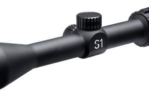 Black rifle scope with adjustable turrets, magnification ring, and a green-tinted objective lens.