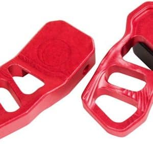 Pair of red plastic bicycle toe clips for pedals, shown separately and with mounting hardware visible.