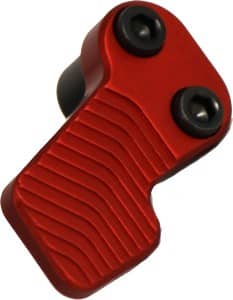 Red plastic handheld device with a ribbed grip and two black circular knobs, viewed at an angle.