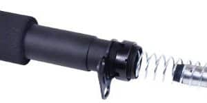 Close-up of a microphone head with a black foam windscreen and a flexible metal gooseneck.