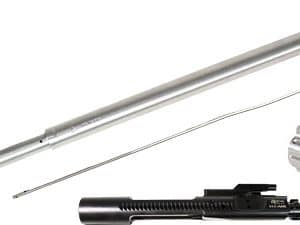 Disassembled firearm components on a white background: a long metal barrel, a thin pin, a clamp, and a black rail assembly with mounting hardware.