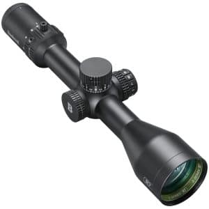 Black Bushnell riflescope with three adjustment dials and a large eyepiece, shown at an angled view for aiming precision