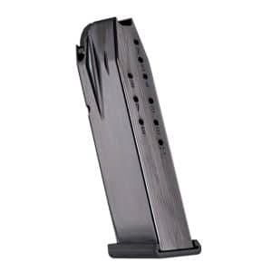 Metal handgun magazine standing upright on its baseplate, with round-count holes along the side.