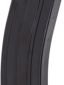 Black curved rifle magazine standing upright