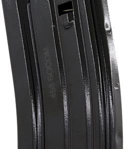 Black curved detachable rifle magazine (metal/plastic) standing upright against a white background