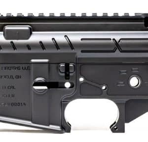 AR-style rifle lower receiver with trigger and integrated accessory rail, black metal, shown from side