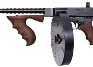 Long-barreled rifle with wooden stock and a large drum magazine.