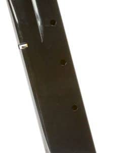 Black metal firearm magazine resting on a base plate, viewed at tilt.