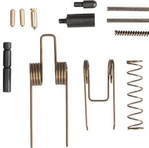 Assorted hardware kit including various springs, pins, and small metal fasteners laid out on a white background.