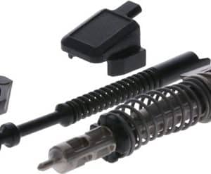 Disassembled automotive fuel injector with nozzle, spring, and retaining clips.