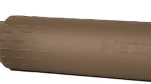 Tan firearm suppressor (silencer) with black mounting adapter detached from a weapon; cylindrical with ribbed exterior and end-cap.