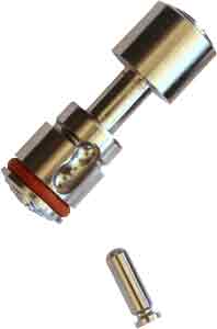 Metal valve cartridge assembly with red gasket and surrounding fittings, angled for detail view.