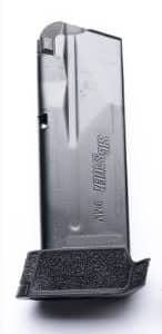 Close-up of a metal razor blade cartridge with a textured black grip at the bottom.