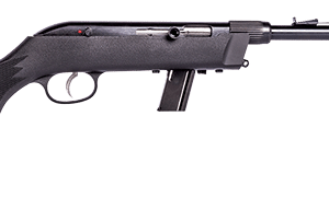 Black bolt-action rifle lying on a white surface with the stock and trigger visible