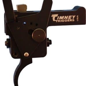 Close-up of a Timney Triggers rifle trigger assembly with a curved lever and adjustment screws.