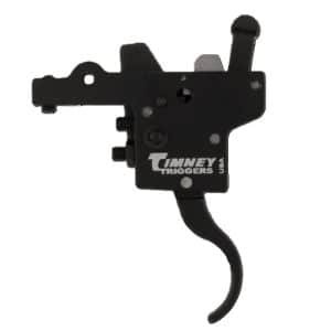 Close-up of a black Timney Triggers firearm trigger mechanism with a curved external lever, side view