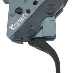 A bicycle gear shifter with a long black trigger lever and gray metal housing, used to change gears on a bike.