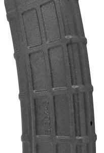 Gray detachable firearm magazine standing upright on a flat surface (rifle/pistol magazine).