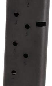 Black handgun magazine with visible rounds at the top and numbered witness holes along the side, resting on a small base plate.