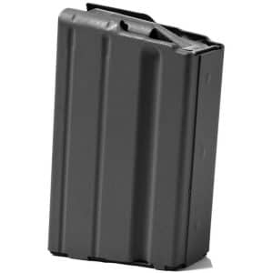 Black metal rifle magazine standing upright against a white background, ribbed with vertical grooves.