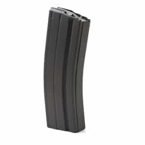 Black curved rifle magazine standing upright, metal and black finish, with a slightly tapered top end.