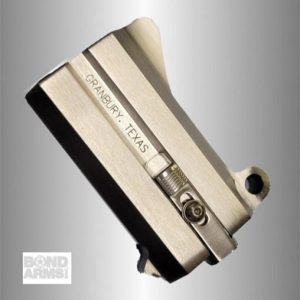 Bond Arms pistol barrel/slide with 'Granbury, Texas' engraving on a gray background, angled view.