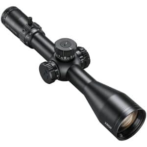 Black rifle scope with multiple adjustment knobs and a large objective lens, angled diagonally across the image.