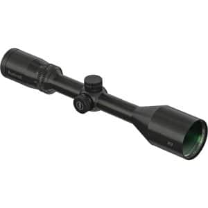 Bushnell rifle scope with adjustable magnification and dual adjustment knobs, mounted on a tube-style body.