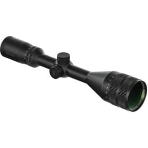 Black riflescope with adjustable turrets and a green-tinted front lens lying diagonally on a white background. The Bushnell branding is visible on the eyepiece center.