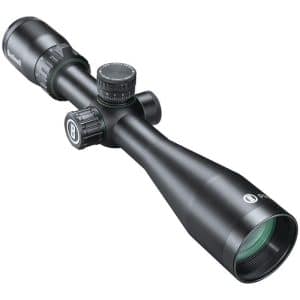 Black Bushnell riflescope with adjustment turrets and a large objective lens, viewed from the side.