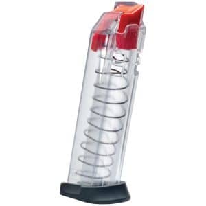 Transparent lighter with red ignition top and visible coil spring inside, resting on a black base.