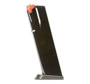 Black metal firearm magazine with an orange follower, angled and resting on a small base.