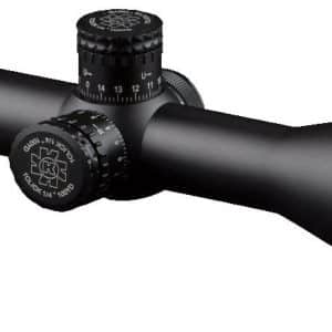 Black riflescope with adjustment turrets and large front lens